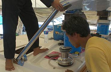 Booglia checks the fit of the bottom of the portside bimini leg