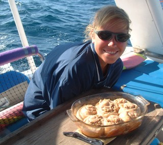 Happy 14 year old with cinnamon rolls for breakfast