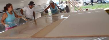 Spreading epoxy resin on the 9x10.6' (2.75x3.25m) bimini foam