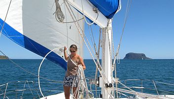 Amanda coiling the halyard as we leave Mitsio