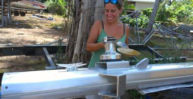 Painting the second coat of Nyalic onto the base of the mast