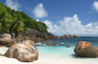 Weather-worn granite on white sand beaches