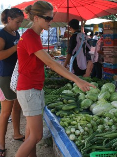 Choosing veggies from the Ao Chalong market