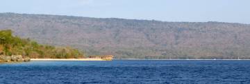 Approaching Moyo, with several boats anchored