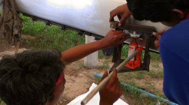 AME machinists trying to press a bushing into a mast tang