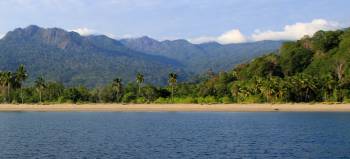 The long beach and pretty hills above Balantia