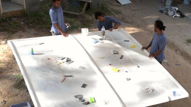 Kwan, Bank, & Chai working on the top of the bimini