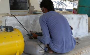 Sanding filler on the back of the aft cockpit seat