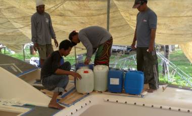 Sticking down the big "boomerang" piece on the port foredeck