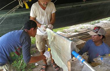 Baw, Jon and Heru wetting out another sheet of biaxial