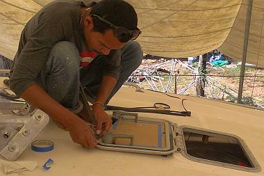 Baw gluing the gaskets into our salon hatches