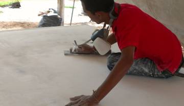 Baw long-boarding the underside of the bimini