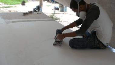 Baw sanding the gelcoat under the bimini - it takes a LONG time