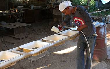 Baw spraying 670 primer on the interior hatch trim pieces