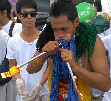 We hadn't seen strings of beads pushed through cheeks before