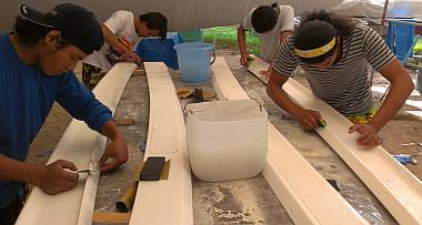 Akoosh, Yando, Ben, and Chambron sanding the louver gelcoat