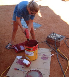 Amanda mixing up the paint to distribute the copper