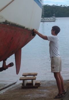 Chris attacks the dirty waterline with scrubbies and lots of elbow grease.