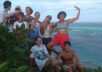 Three cruising families clowning around in Tobago Cays