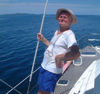 Jon's dad holds a cap shroud which is covered in plastic pipe to prevent sail abrasion