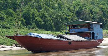 These freighters carry heavy goods up the rapids!