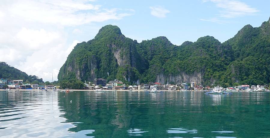 Sheer karst cliffs behind El Nido town