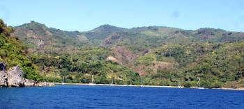 Several boats anchored in the bay at Gedong