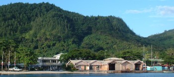 The waterfront of Huahine shows its one street of docks and businesses.