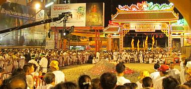 Crowds at the temple around the huge pile of glowing coals