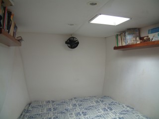 The strb foreword cabin with its fan and bookshelves.