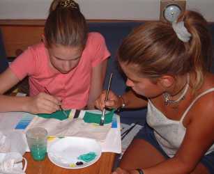 Painting the Dominican flag, flown as a courtesy when in their waters