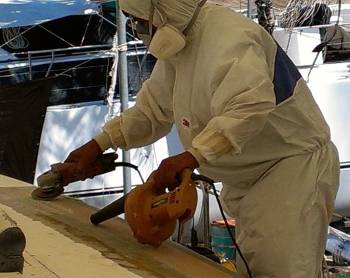 Gow sanding the glass over the port grab-rail trough