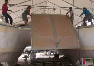 Baw, Amanda, Jon & Houa hoisting the bimini up