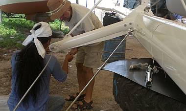 Heru and Jon fitting a spreader tip around the rod rigging