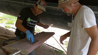 Heru and Jon putting filler on the first rudder