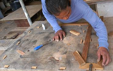 Houa's board of little blocks to help him build teak frames