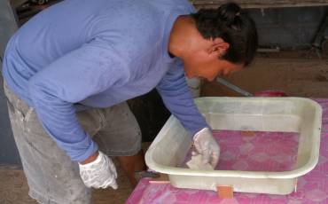 Houa shaping the hatch trim to precisely fit the hatch