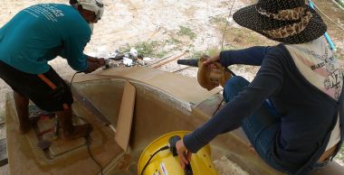 Houa & Mai shaping the top of the new port sugar-scoop wall