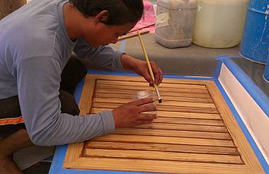 Houa putting Sikaflex Primer (for the calking) in the grooves