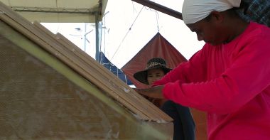 Houa sticking down tapered foam on the port swim platform wall