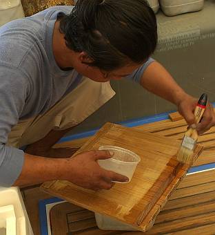 Painting primer on the glued together teak planks