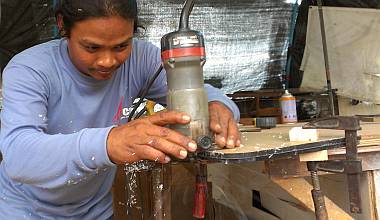 Houa cutting duplicate acrylic panes with his router