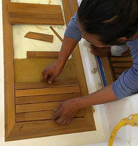 Laying down the glued together teak planks