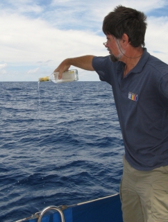 Jon offers Neptune a libation of gin on the Equator