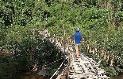 Jon explores a rickety walking bridge over the Namtha River
