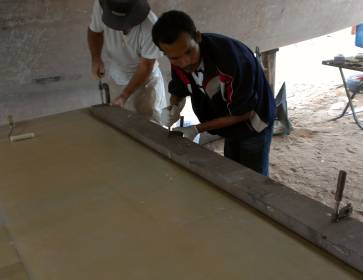 Clamping a board down on the plastic covered bolt surface