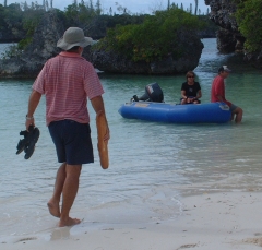 Jon wading out to Scud's dinghy with the daily baquette.