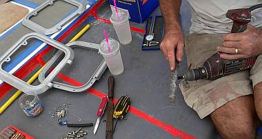 Jon using his drill as a lathe to machine down hard rubber tubing