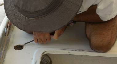 Jon's Hat digging balsa & uncured epoxy from the water fill hole