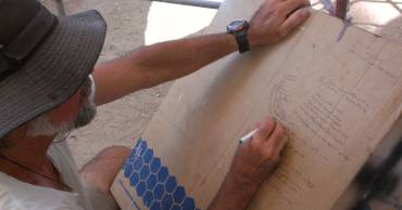 Jon working out the order of the layers - on an old box!